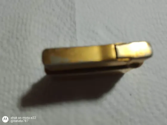 Encendedor decorativo dorado Quilmes