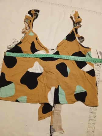 Top musculosa, con volado, espalda abierta. Nueva Floresta