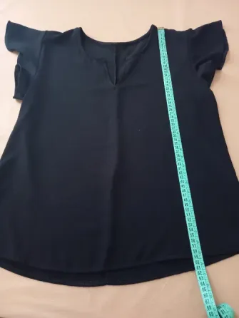 Musculosa elegante con volado en manga. IMPECABLE Floresta